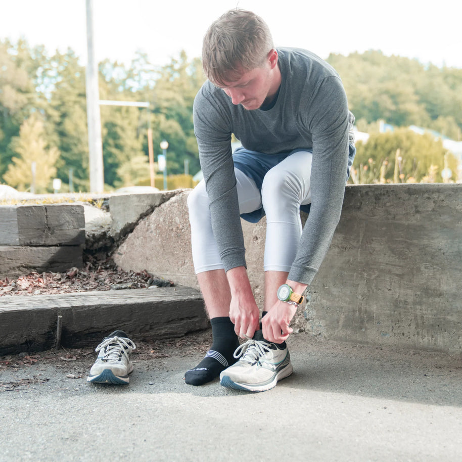 Element Quarter Lightweight w/Cushion Running Sock - Men by Darn Tough in black with mesh panels for breathability, designed for long-distance running.