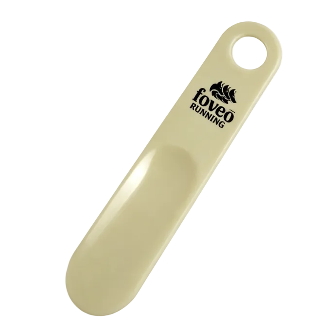 Foveo Running shoe horn in beige plastic with black Foveo Running logo and hanging hole