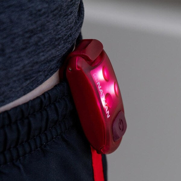 StrobeLight LED Safety Light Clip by Nathan in red, small lightweight LED clip for visibility and safety during running outdoors