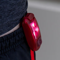 StrobeLight LED Safety Light Clip by Nathan in red, small lightweight LED clip for visibility and safety during running outdoors