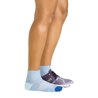Darn Tough women's Run Quarter sock in Sky worn with a running shoe on one foot