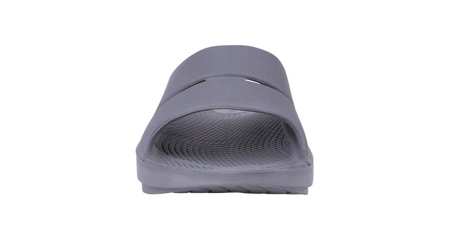 OOahh - Unisex by Oofos in grey, lightweight slides with OOfoam strap for impact absorption and enhanced comfort and support