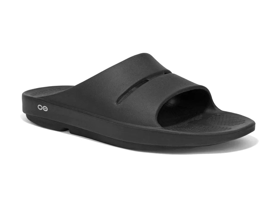 OOahh - Unisex by Oofos in black, lightweight slides with OOfoam strap for impact absorption and enhanced comfort, ideal for recovery and casual wear