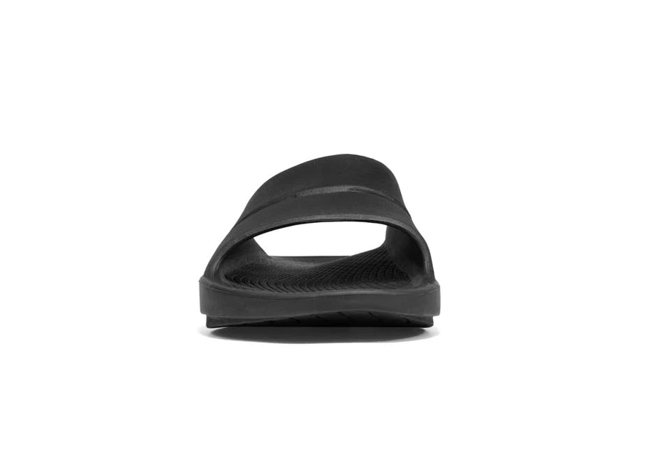 OOahh - Unisex by Oofos in black with agile OOfoam strap, shock-absorbing slides designed for all-day comfort and support.
