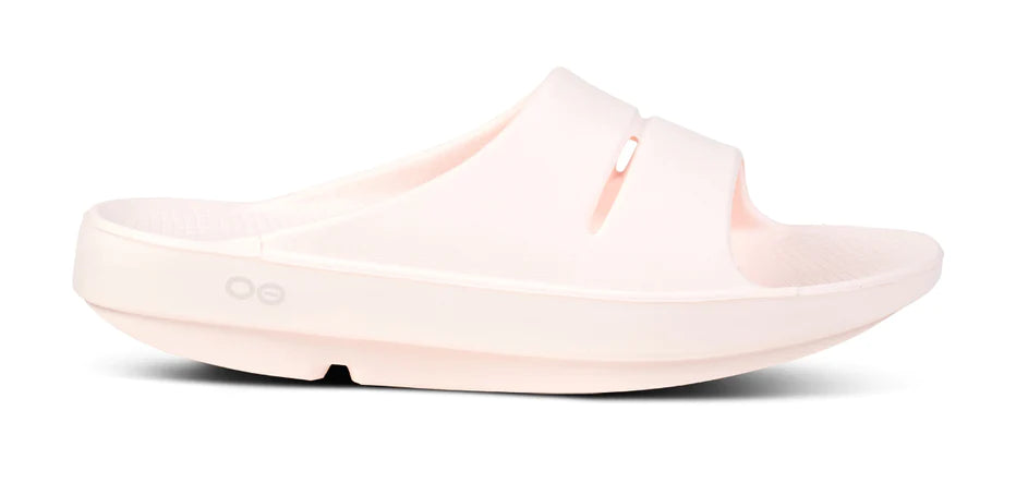 OOahh - Unisex by Oofos in light pink with OOfoam strap for impact absorption, lightweight slide ideal for recovery and comfort