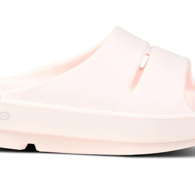 OOahh - Unisex by Oofos in light pink with OOfoam strap for impact absorption, lightweight slide ideal for recovery and comfort