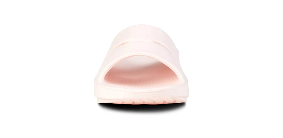 OOahh - Unisex by Oofos in light pink with OOfoam strap for enhanced support and impact absorption, ideal for recovery and casual wear