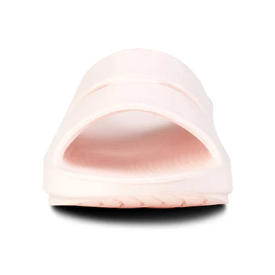OOahh - Unisex by Oofos in light pink with OOfoam strap for enhanced support and impact absorption, ideal for recovery and casual wear