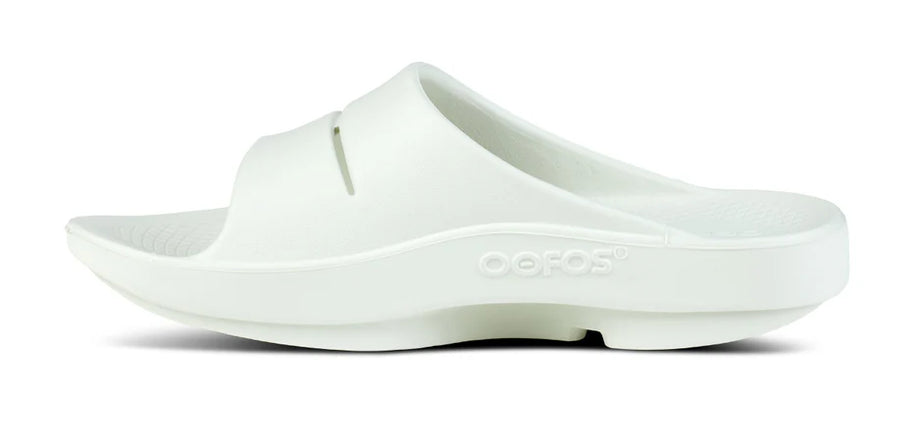 OOahh - Unisex by Oofos in white slide with agile OOfoam strap, impact-absorbing footbed for comfort and support, ideal for recovery and casual wear