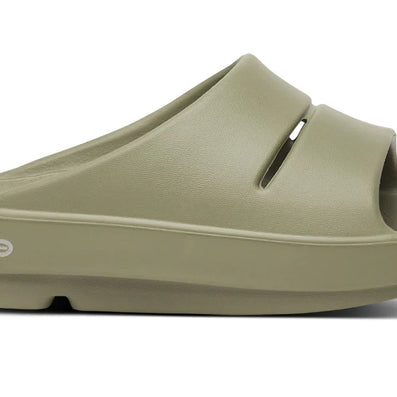 OOahh - Unisex by Oofos in olive green with agile OOfoam strap, impact-absorbing slides designed for comfort and recovery walkwear
