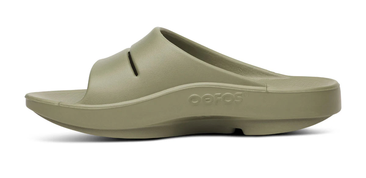 OOahh - Unisex in olive green by Oofos, lightweight slides with OOfoam strap for enhanced support and 37% more impact absorption.