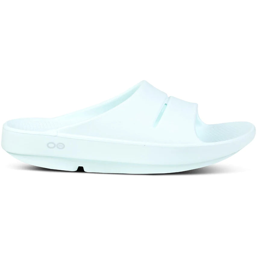 OOahh - Unisex by Oofos in light blue, comfortable slides with OOfoam strap for impact absorption and all-day support