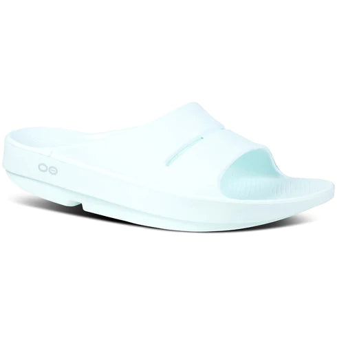 OOahh - Unisex by Oofos in light blue, slide sandals with OOfoam strap for impact absorption and comfort, ideal for recovery and casual wear