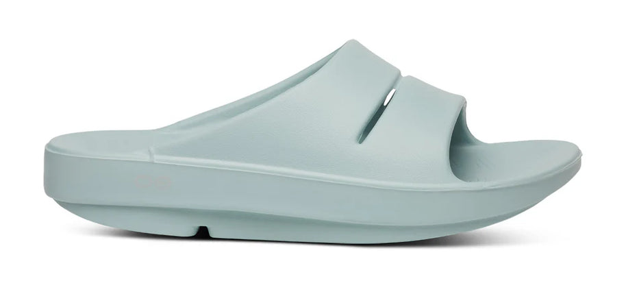 OOahh - Unisex by Oofos in light blue with agile OOfoam strap for superior support and 37% more impact absorption, ideal recovery slides