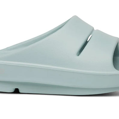 OOahh - Unisex by Oofos in light blue with agile OOfoam strap for superior support and 37% more impact absorption, ideal recovery slides