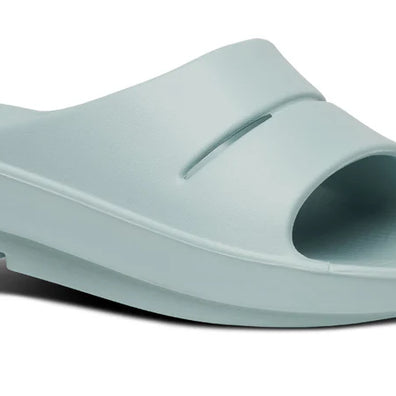 OOahh - Unisex slide by Oofos in light blue with OOfoam strap for impact absorption and comfort, ideal for recovery and casual wear