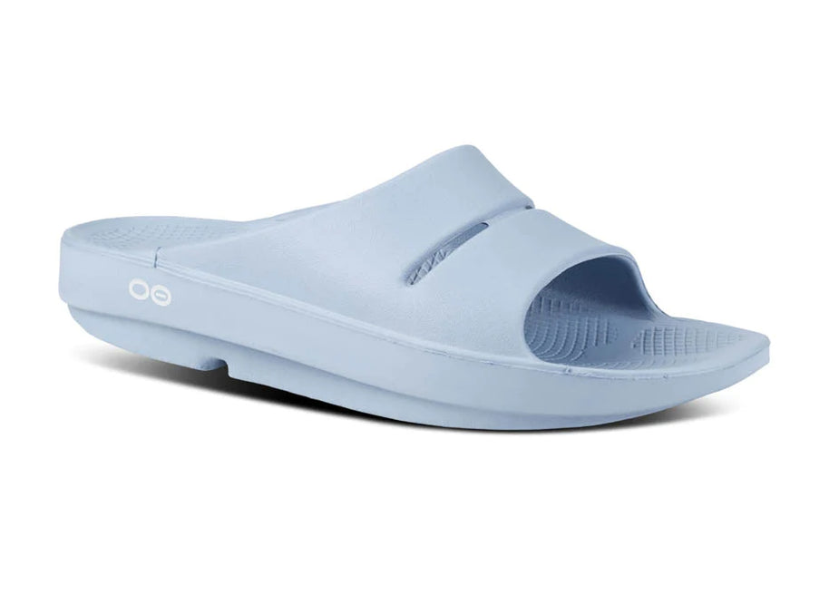 OOahh - Unisex by Oofos in light blue slide with OOfoam strap for impact absorption, support, and comfort, ideal for recovery and casual wear
