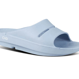 OOahh - Unisex by Oofos in light blue slide with OOfoam strap for impact absorption, support, and comfort, ideal for recovery and casual wear