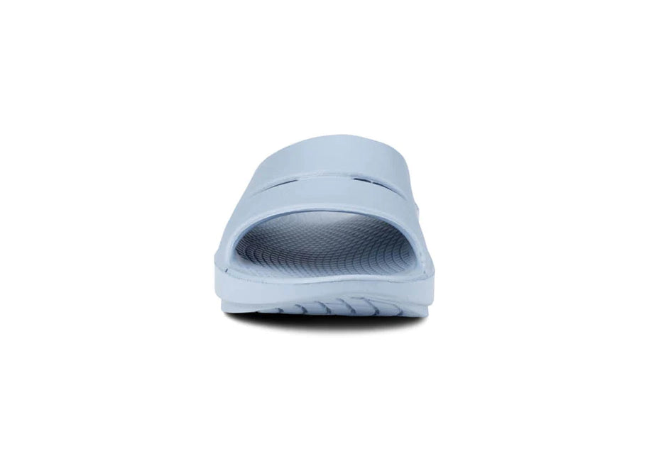 OOahh - Unisex by Oofos in light blue with agile OOfoam strap for support, impact absorption, ideal for recovery and casual wear