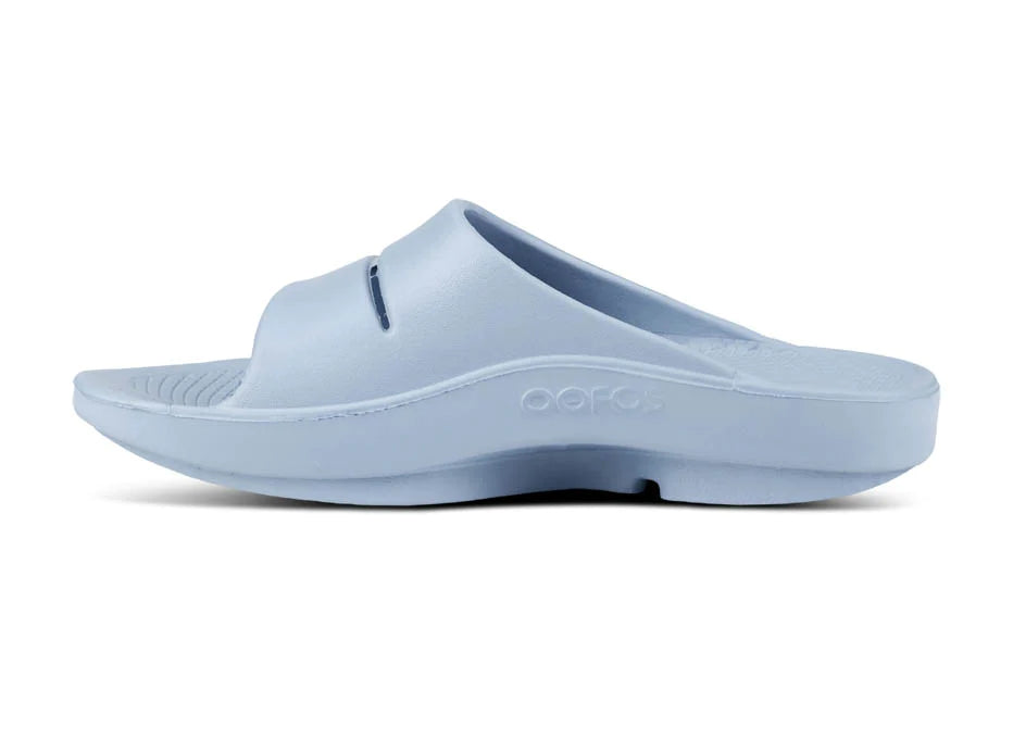OOahh - Unisex by Oofos in light blue slide with agile OOfoam strap offering 37% more impact absorption and comfort
