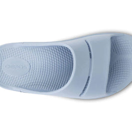 OOahh - Unisex by Oofos in light blue with OOfoam strap for extra support, impact absorption and comfort, ideal for recovery and casual wear