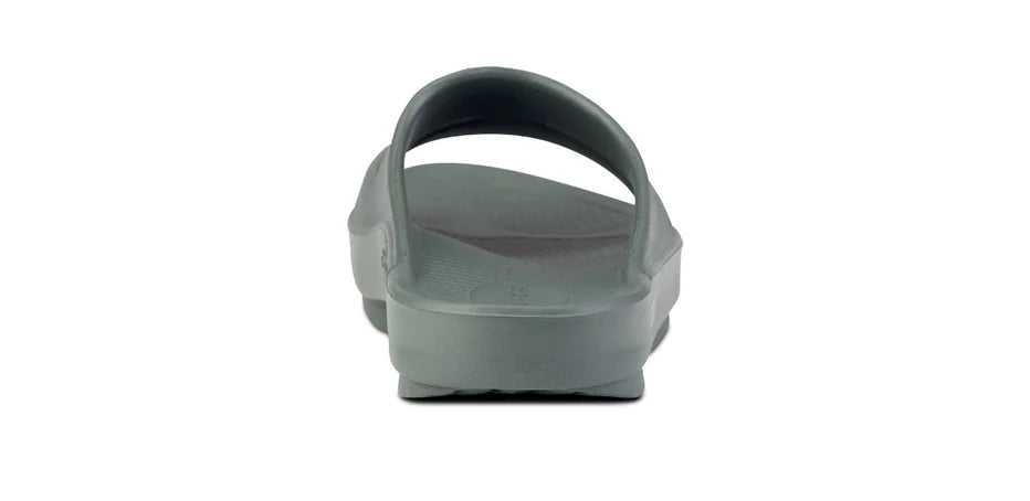OOahh - Unisex by Oofos in grey with OOfoam strap for impact absorption and comfort, durable slides ideal for recovery and casual wear