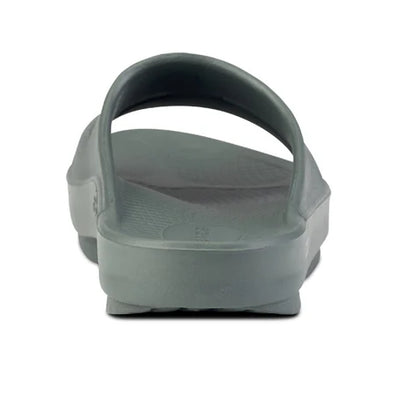 OOahh - Unisex by Oofos in grey with OOfoam strap for impact absorption and comfort, durable slides ideal for recovery and casual wear