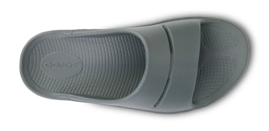 OOahh - Unisex by Oofos in grey with OOfoam strap for impact absorption and support, ideal for recovery and casual wear.