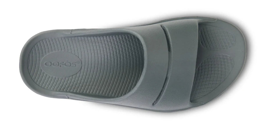 OOahh - Unisex by Oofos in grey with OOfoam strap for impact absorption and support, ideal for recovery and casual wear.