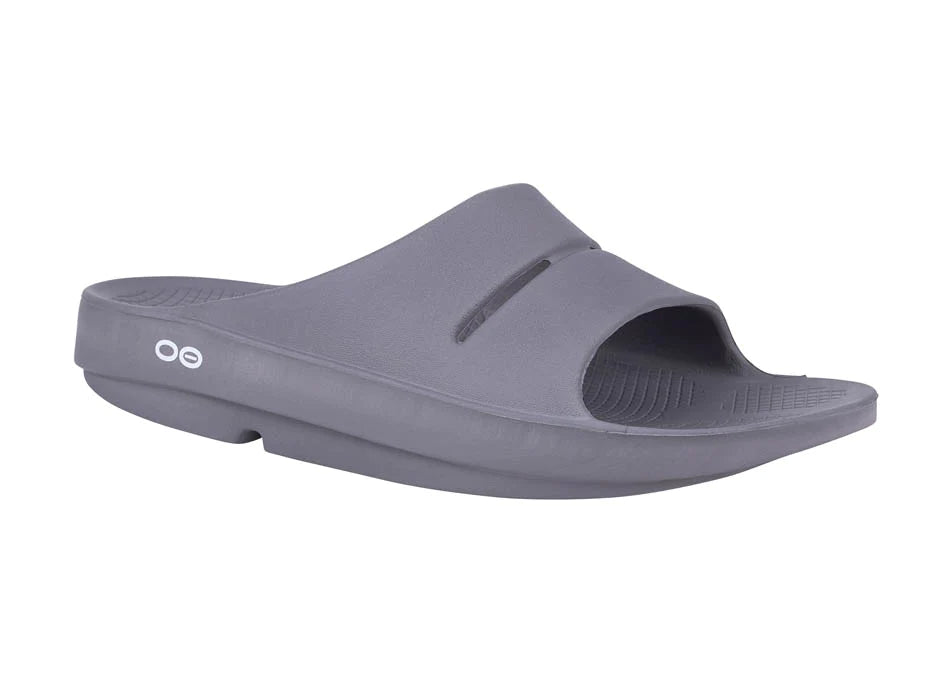 OOahh - Unisex by Oofos in grey, lightweight slides with OOfoam strap for impact absorption and comfort, ideal for recovery and casual wear