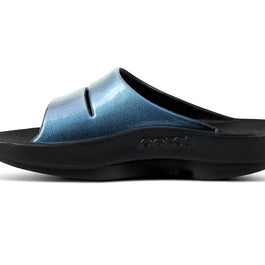 OOahh Luxe - Women by Oofos in metallic blue and black with agile OOfoam strap for support, comfort, and casual outdoor wear.