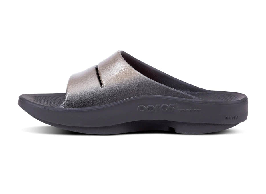 OOahh Luxe - Women by Oofos in metallic grey with agile OOfoam strap for support, comfort, and stylish recovery slides