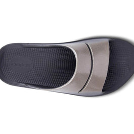 OOahh Luxe - Women by Oofos, black footbed with metallic silver agile OOfoam strap slide for support and comfort