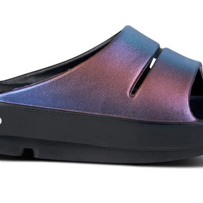 OOahh Luxe - Women by Oofos in iridescent blue and purple slides with OOfoam strap for comfort and support, ideal for recovery and casual wear