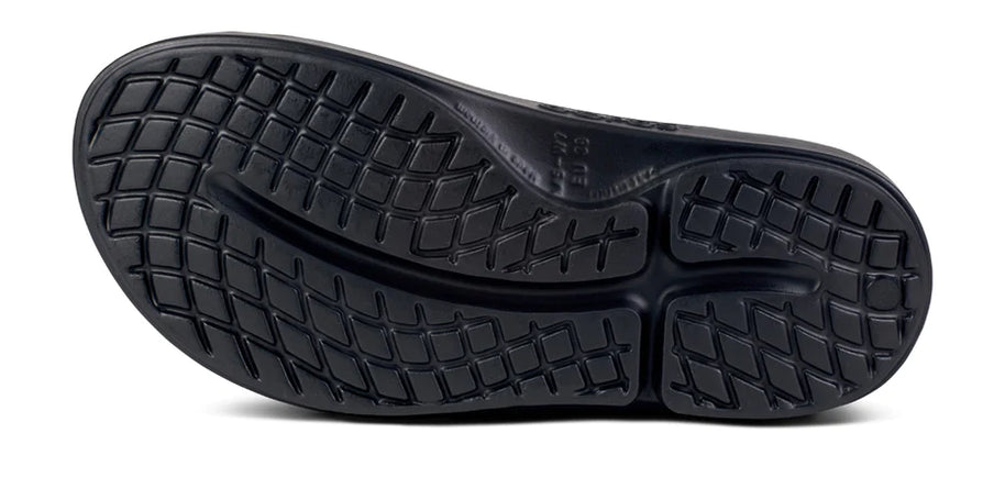 OOahh Luxe - Women by Oofos in black with OOfoam strap for support, comfortable slides designed for recovery and casual outdoor wear