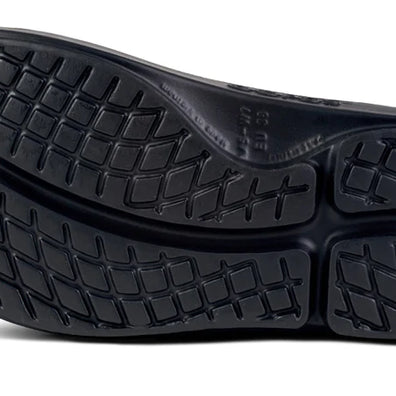 OOahh Luxe - Women by Oofos in black with OOfoam strap for support, comfortable slides designed for recovery and casual outdoor wear