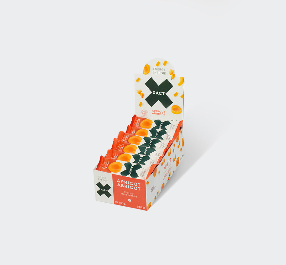Display box of Xact Energy Fruit Bars in Apricot, open carton holding a row of wrapped bars