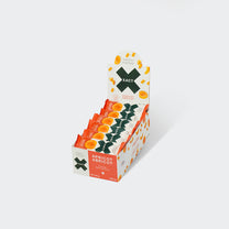 Display box of Xact Energy Fruit Bars in Apricot, open carton holding a row of wrapped bars
