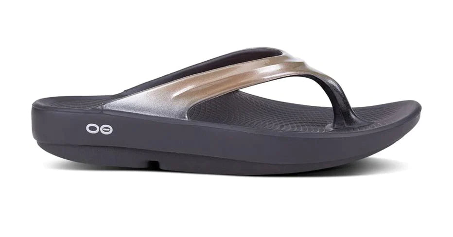 OOlala Luxe - Women by Oofos in black and metallic gold with patented OOfoam footbed, lightweight slides for all-day comfort and style