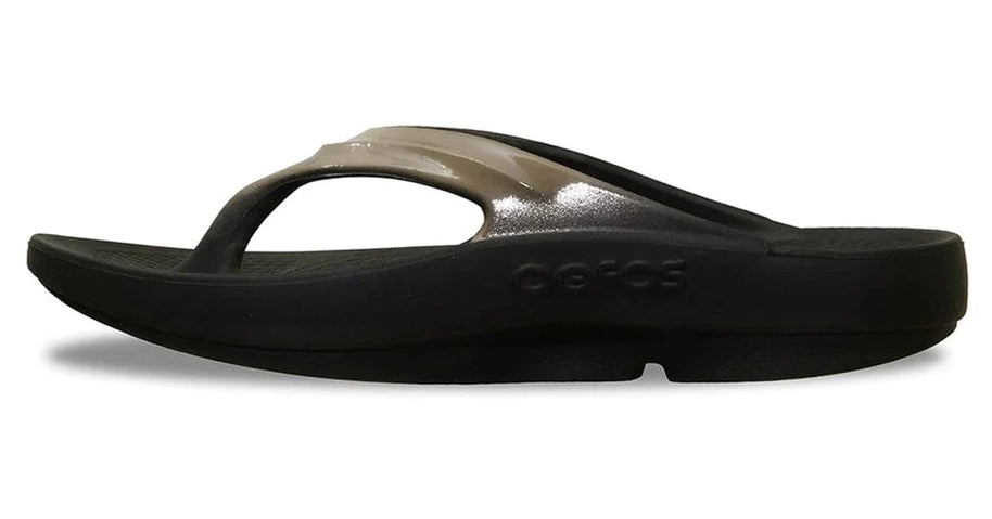 OOlala Luxe - Women by Oofos in black and metallic taupe slides with OOfoam footbed for comfort and stylish everyday wear