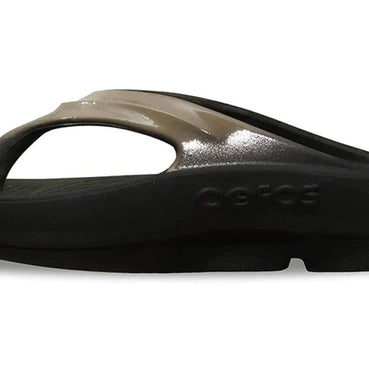 OOlala Luxe - Women by Oofos in black and metallic taupe slides with OOfoam footbed for comfort and stylish everyday wear
