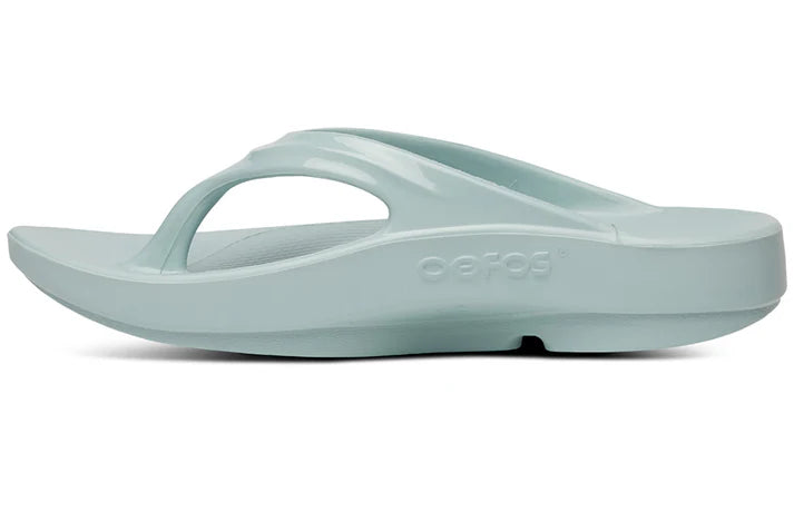 OOlala - Women by Oofos in light blue slide sandal with patented OOfoam footbed for 37% more impact absorption, ideal for casual wear and recovery
