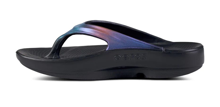 OOlala Luxe - Women by Oofos in black with hand-painted iridescent straps, lightweight OOfoam slides for all-day comfort and style