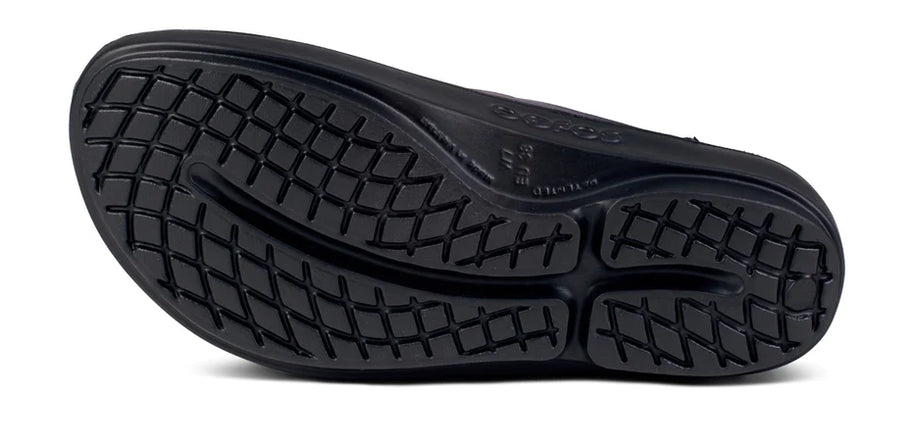 OOlala Luxe - Women by Oofos in black, lightweight patented OOfoam slide sandal with streamlined footbed for all-day comfort and style