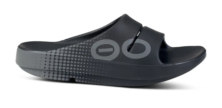 OOahh Sport - Unisex by Oofos in black and grey with agile OOfoam strap for support and 37% impact absorption, ideal recovery footwear