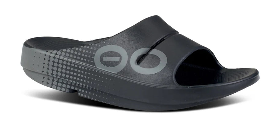 OOahh Sport - Unisex by Oofos in black with bold sporty graphics, agile OOfoam strap for support and 37% impact absorption