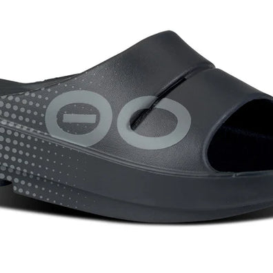 OOahh Sport - Unisex by Oofos in black with bold sporty graphics, agile OOfoam strap for support and 37% impact absorption