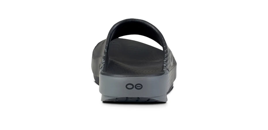 OOahh Sport - Unisex by Oofos in black and grey with OOfoam strap for support, comfort, and shock absorption, ideal for active recovery