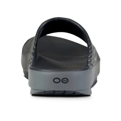 OOahh Sport - Unisex by Oofos in black and grey with OOfoam strap for support, comfort, and shock absorption, ideal for active recovery