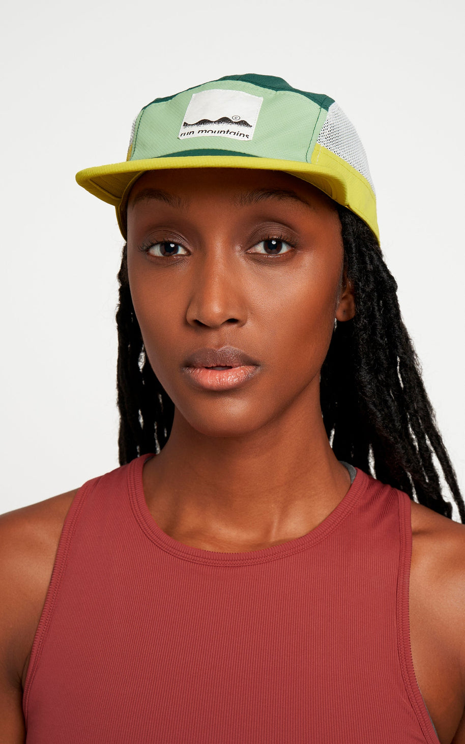 ALZCap Trail - Mountain Cut by Ciele in green, yellow, and white with COOLmatic PLUS mesh for cooling and odor protection, ideal for trail running